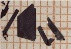 Typical plate-like single crystals of Cu2OCl2 grown by chemical vapor transport.